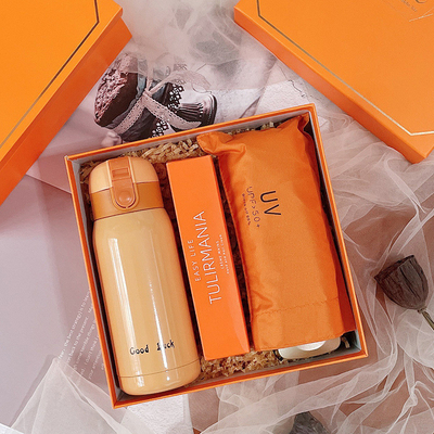 Customized Color Orange Fashion Entry Gift with Hand Warm Cup Notebook Good Luck Pendant